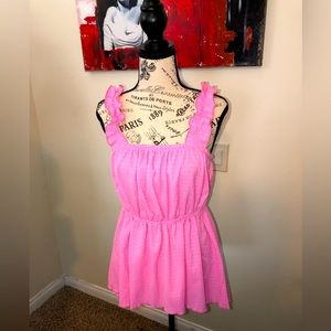 Beautiful, never worn pink tank top with ruffled straps. Stretchy crepe design.